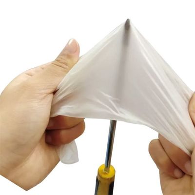 Gants médicaux jetables de latex de longueur blanche laiteuse de 240mm ambiants