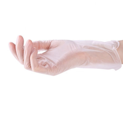 Saupoudrez les gants lisses transparents libres de vinyle de contact